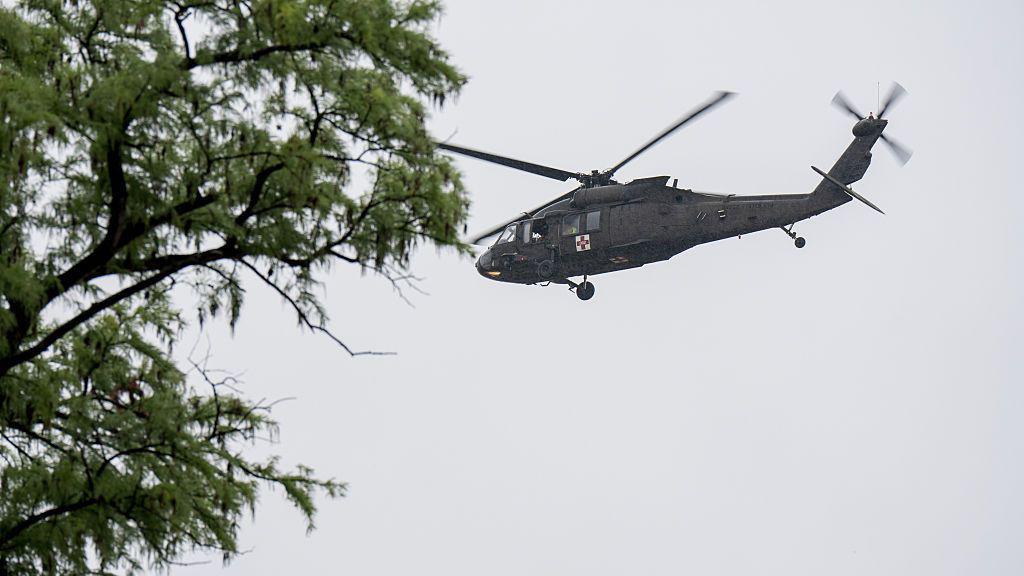 A UH-60 Black Hawk helicopter conducts rescue operations along the Guadalupe River on July 4, 2025