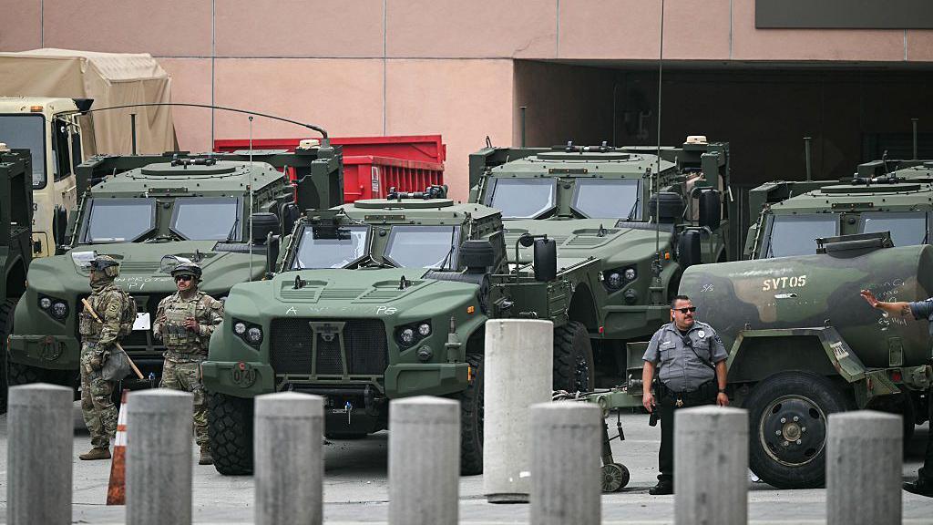 California National Guard troops and vehicles deployed to Los Angeles on Sunday in the wake of protests against federal immigration raids.