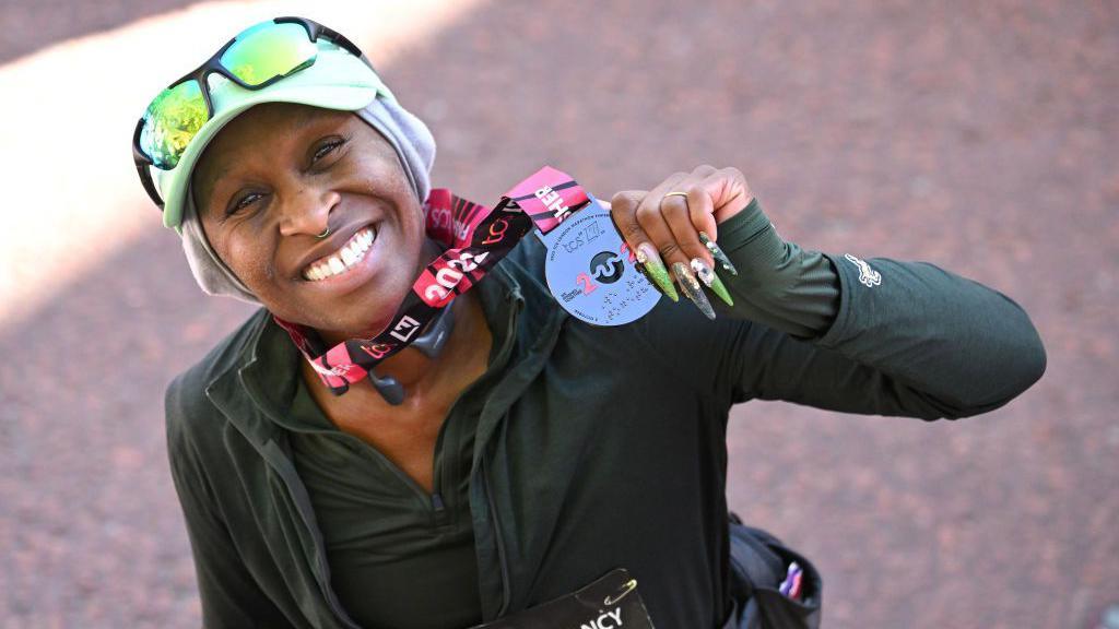  Cynthia Erivo completes the 2022 TCS London Marathon on The Mall on October 02, 2022 in London, England.