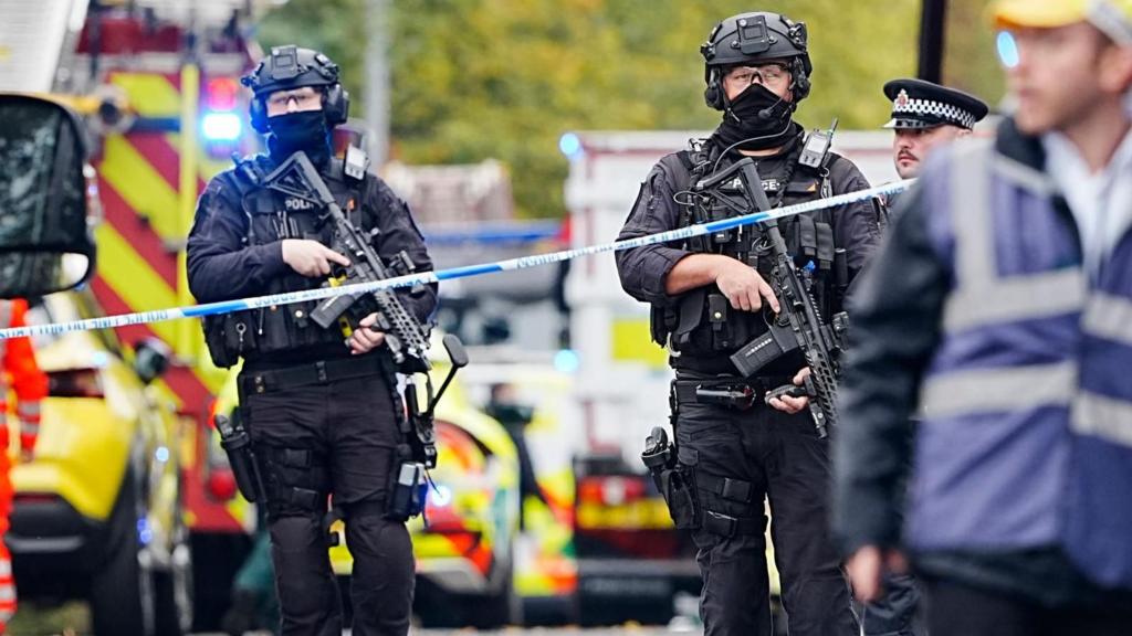 Two armed policemen at scene