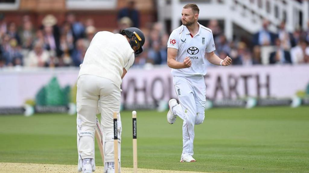 Gus Atkinson celebrates after bowling out Matt Henry to win England the first Test against New Zealand