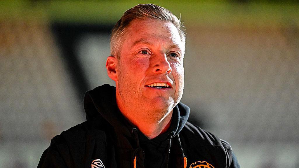 A smiling Cambridge United boss Neil Harris