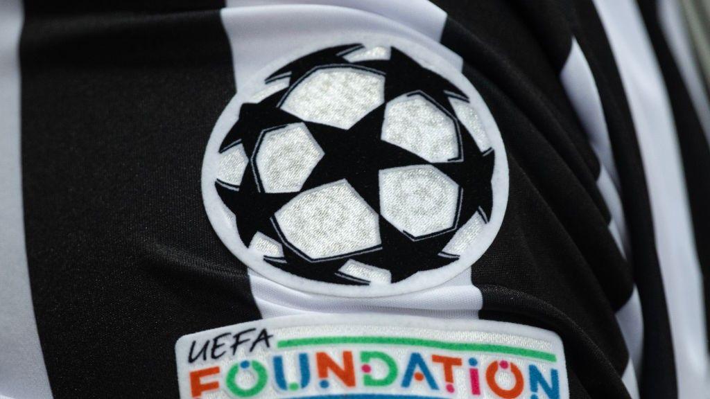 Champions League badge on a Newcastle kit