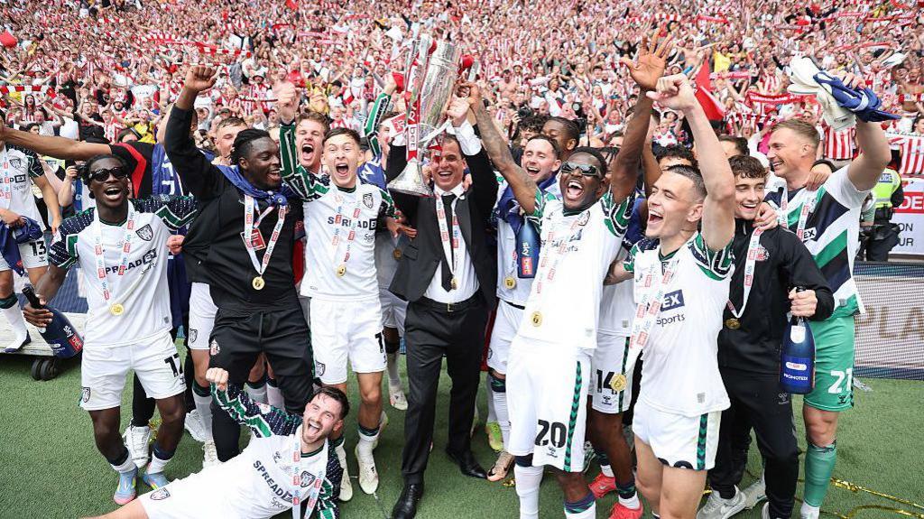 Sunderland celebrate in front of there fans after winning the Championship Play-Off Final match between Sheffield United FC and AFC Sunderland at Wembley Stadium on May 24, 2025.