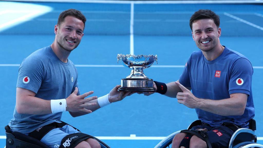 Alfie Hewett and Gordon Reid with the Australian Open trophy.