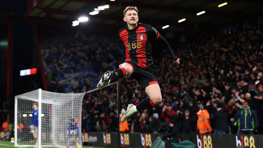 Bournemouth's David Brooks jumps in the air as he celebrates scoring 