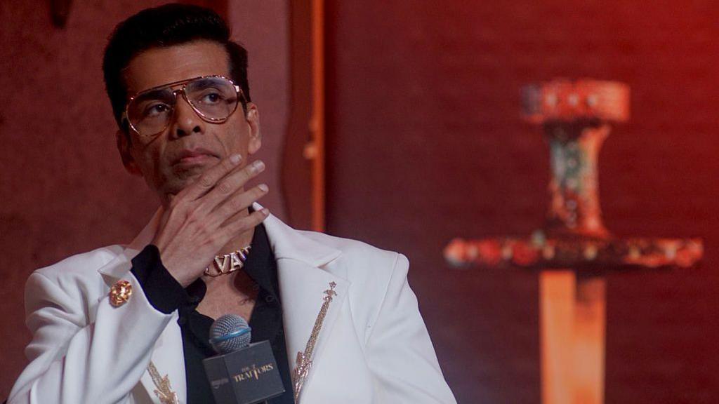 Karan Johar, wearing a white jacket and eye-glasses, attends the trailer launch of Amazon Prime series 'The Traitor' at Yashraj studio, Andheri on May 30, 2025 in Mumbai, India.