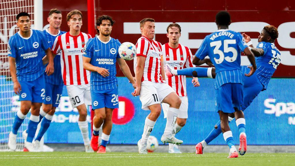 Brighton's Ibrahim Osman shooting at a wall of defenders