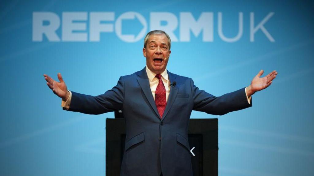 Reform UK leader Nigel Farage speaks on stage during the Reform UK East Midlands Conference at the Athena Events Venue
