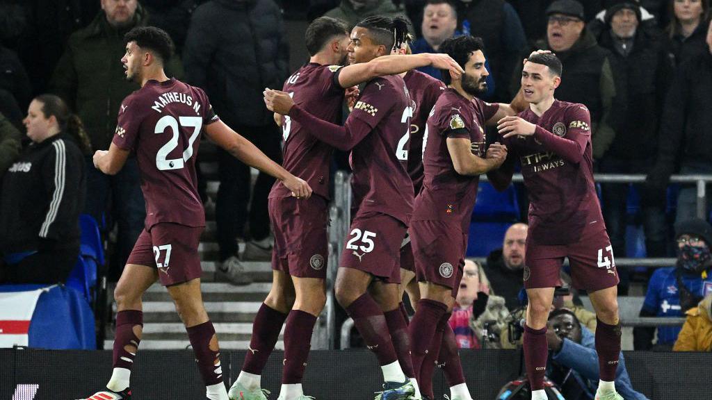 Manchester City's players celebrate a goal