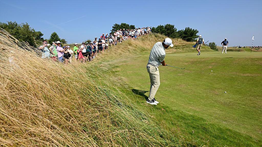 Scottie Scheffler taking a practice chip at Royal Birkdale