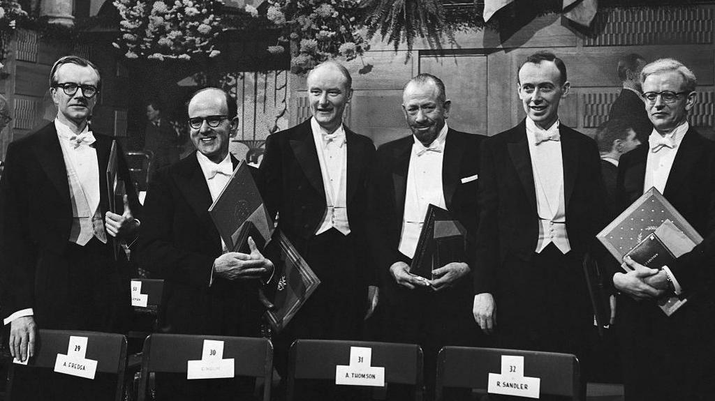 Photo of the 1962 Nobel prize winners: Professor Maurice Wilkins, Dr. Max Perutz, Prof. Francis Crick, John Steinbeck, Dr. James Watson, and Dr. John Kendrew