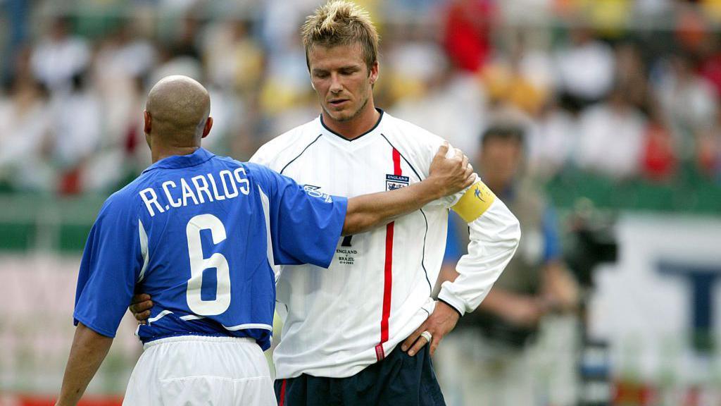 Roberto Carlos consoles David Beckham after Brazil beat England in the 2002 World Cup