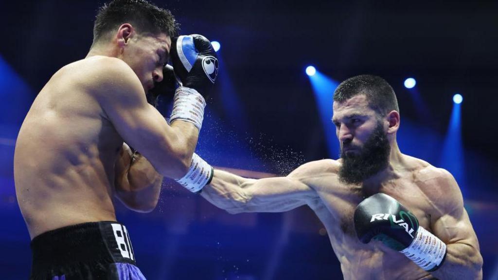 Artur Beterbiev lands a close    hook connected  Dmitry Bivol