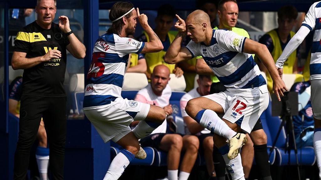 Michael Frey of Queens Park Rangers, right, celebrates with teammate Lucas Andersen. 