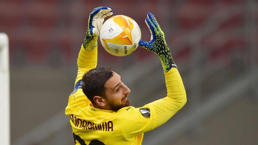 Gianluigi Donnarumma in action for AC Milan against Manchester United in the Europa League in 2014