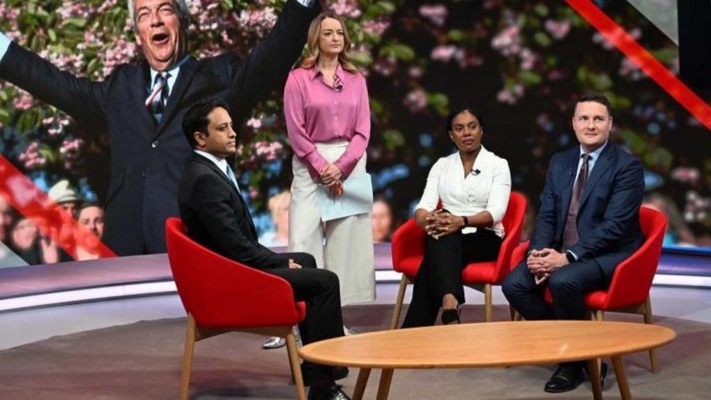 Laura Kuenssberg stands with Kemi Badenoch, Wes Streeting and Zia Yusuf.