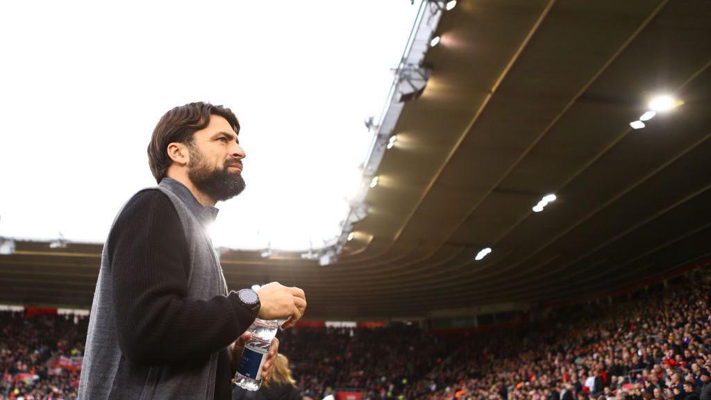 Southampton manager Russell Martin during the Premier League match between Southampton FC and Everton FC at St Mary's Stadium on 2 November 2024 at St Mary's stadium. He is walking towards the crowd with a bottle of water in his hand 