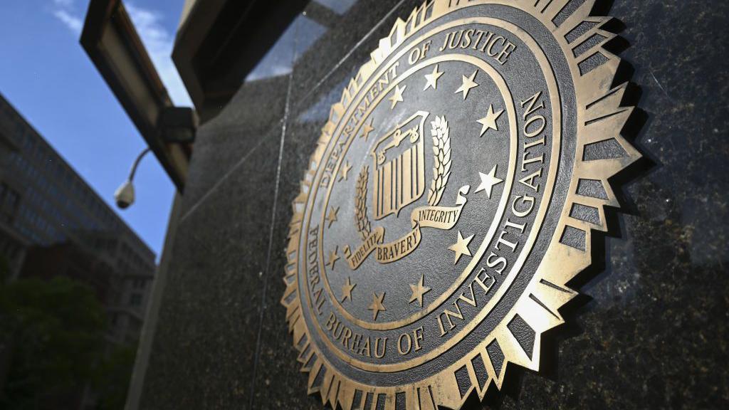 A picture of the FBI seal on the side of a building