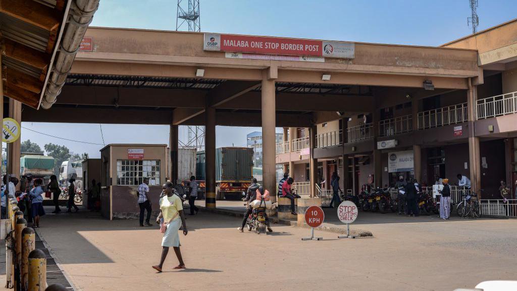 A general view of the Kenyan side of the Malaba border post. A security booth can be seen under an arch, which has a banner that says "Malaba One Stop Border Post".