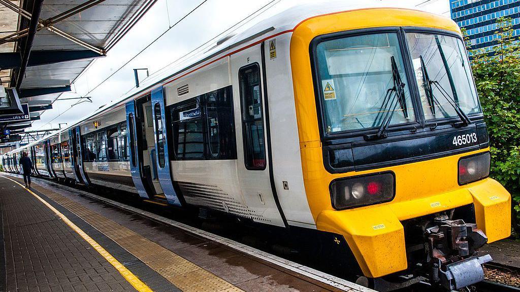 A close-up shot of a white and black train.