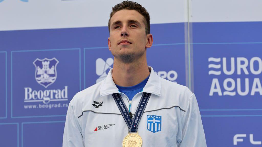 Kristian Gkolomeev on the podium with a medal