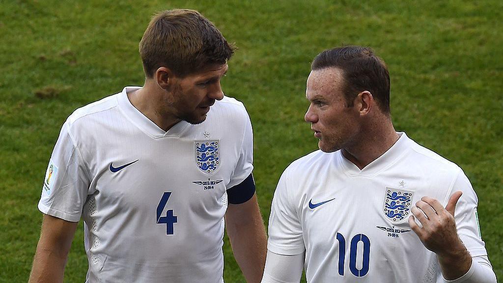 Steven Gerrard and Wayne Rooney talk after a 2014 World Cup game against Costa Rica