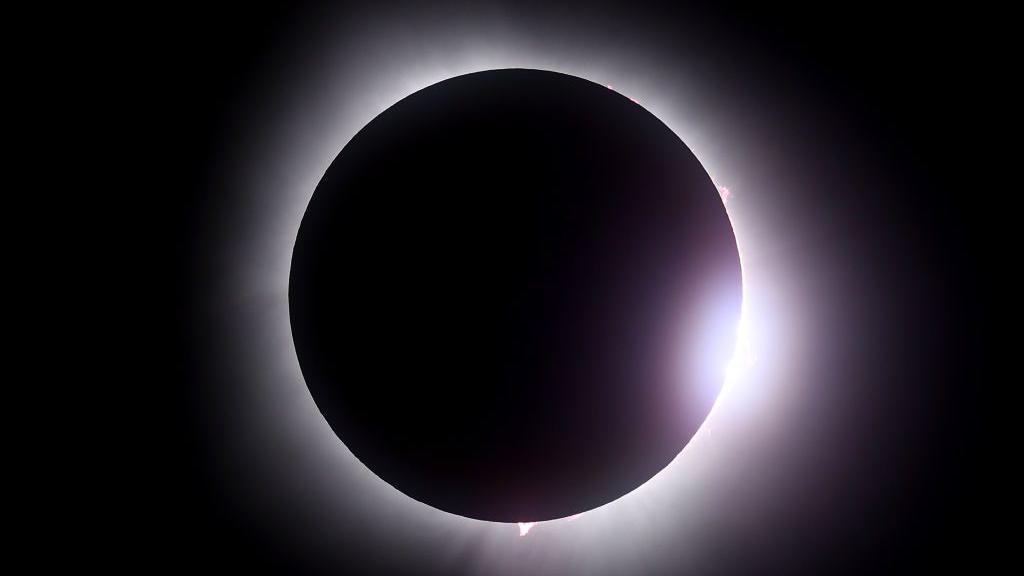 MARTIN, OHIO - APRIL 08: The moon passes in front of the sun during a solar eclipse on April 08, 2024 in Martin Ohio. Millions of people have flocked to areas across North America that are in the "path of totality" in order to experience a total solar eclipse. During the event, the moon will pass in between the sun and the Earth, appearing to block the sun. (Photo by Gregory Shamus/Getty Images)