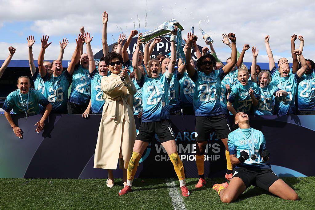 Owner Michele Kang celebrates with the London City Lionesses players after winning promotion to the top-flight