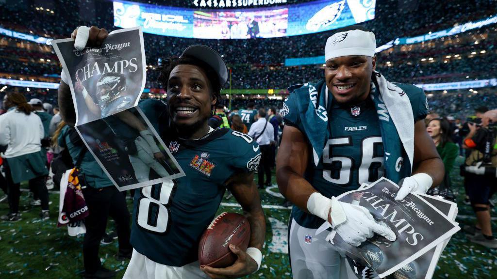 C.J. Gardner-Johnson #8 and Jalyx Hunt #58 of the Philadelphia Eagles celebrate after beating the Kansas City Chiefs 40-22