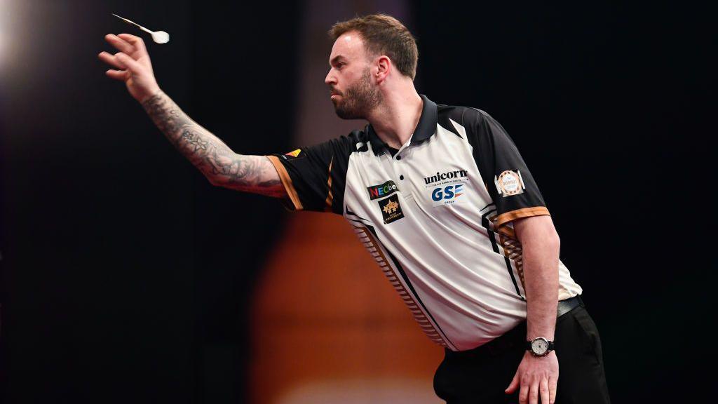 Ross Smith of England throws during the European Darts Grand Prix on April 21, 2024 in Sindelfingen, Germany.