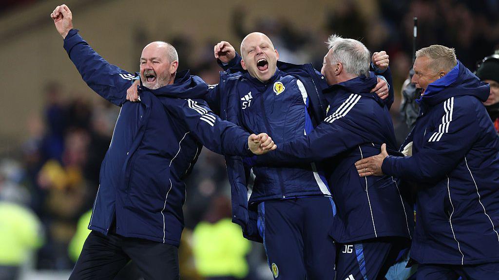 Head coach of Scotland Steve Clarke celebrates with his coaching staff during the World Cup qualifying win over Denmark