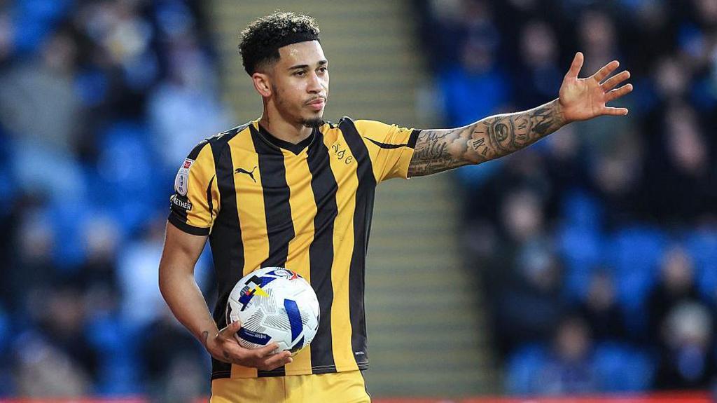 Port Vale full-back Jordan Lawrence-Gabriel holds the ball as he prepares to take a thrown-in