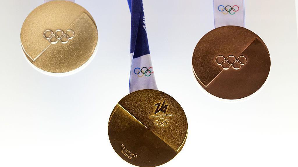 2026 Winter Olympic medals on display.