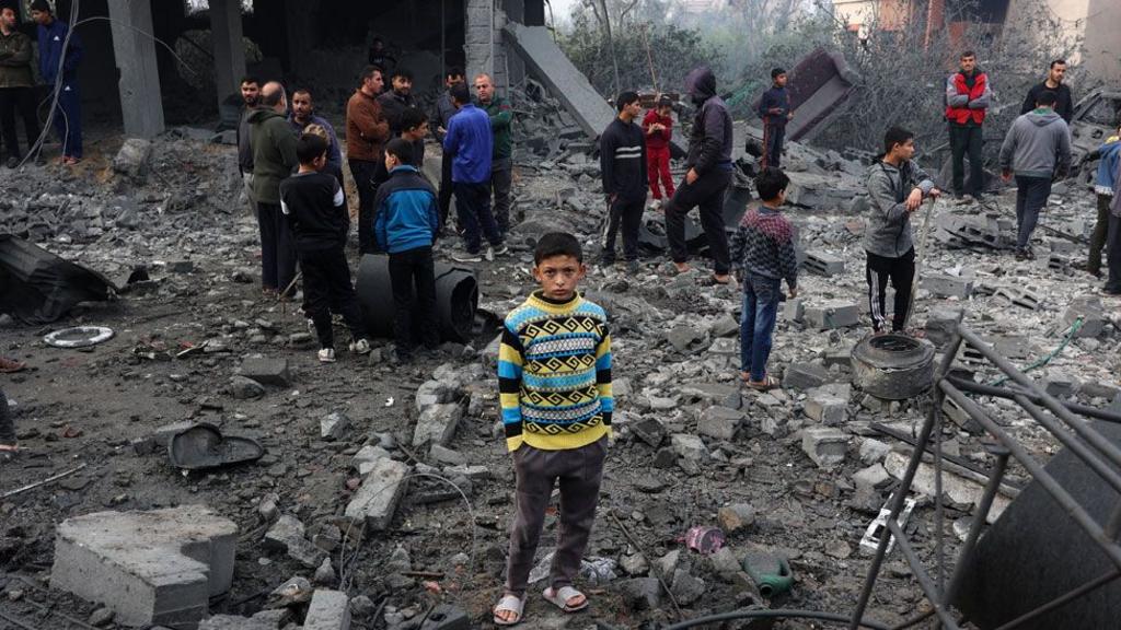 People check the rubble of buildings hit in Israeli strikes the previous night in Jabalia in the northern Gaza Strip, on January 16, 2025