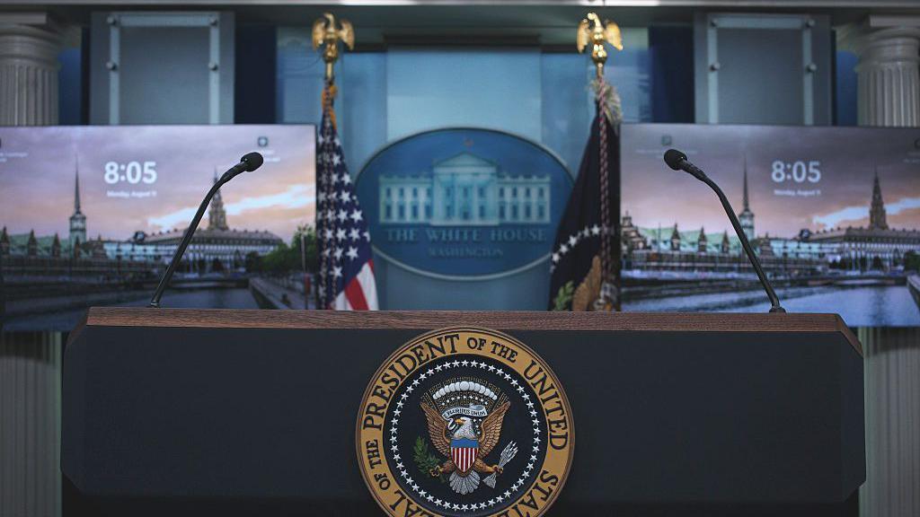 The US Presidential seal on the podium in James Brady Press Briefing Room at the White House, ahead of President Donald Trump's presser, Monday, Aug. 11, 2025, in Washington, D.C.
