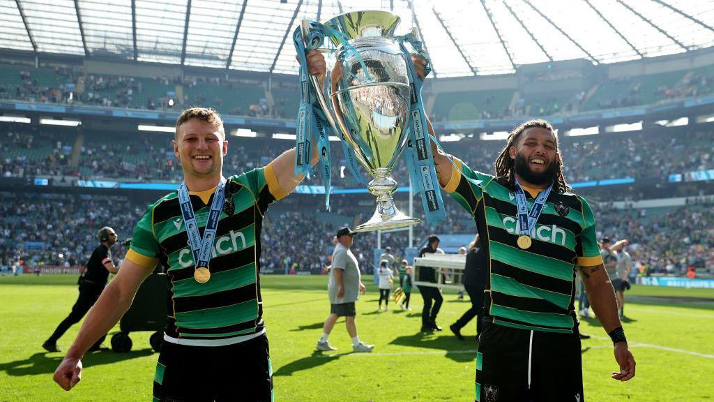 Fraser Dingwall and Lewis Ludlam of Northampton Saints celebrate with the Gallagher Premiership Rugby Trophy