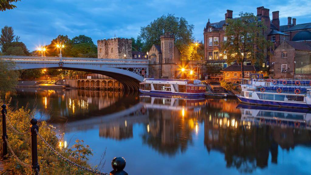 An evening image showing pleasure boats along the River Ouse in York.