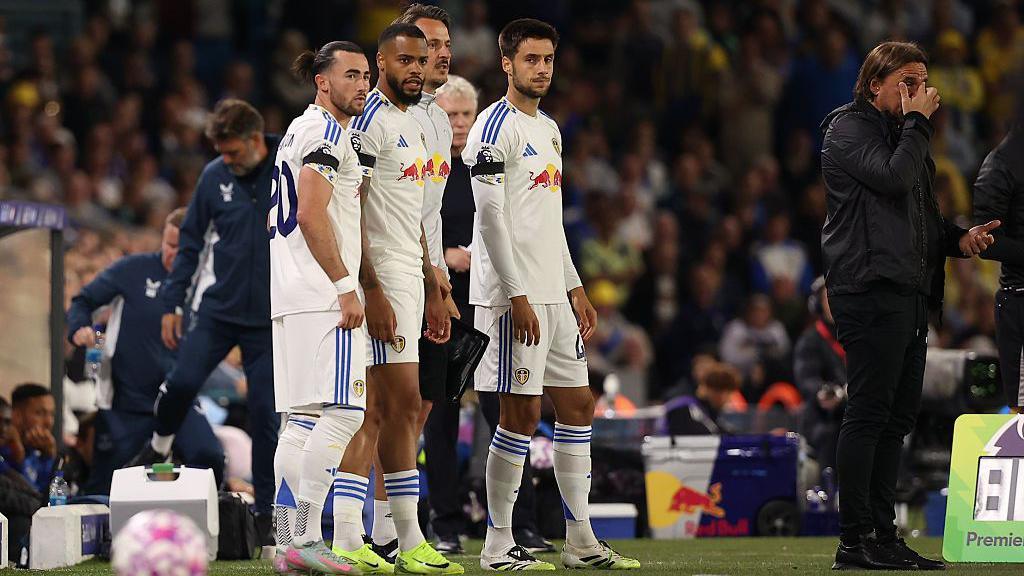 Jack Harrison waits to come on as a substitute with Lukas Nmecha and Ilia Gruev