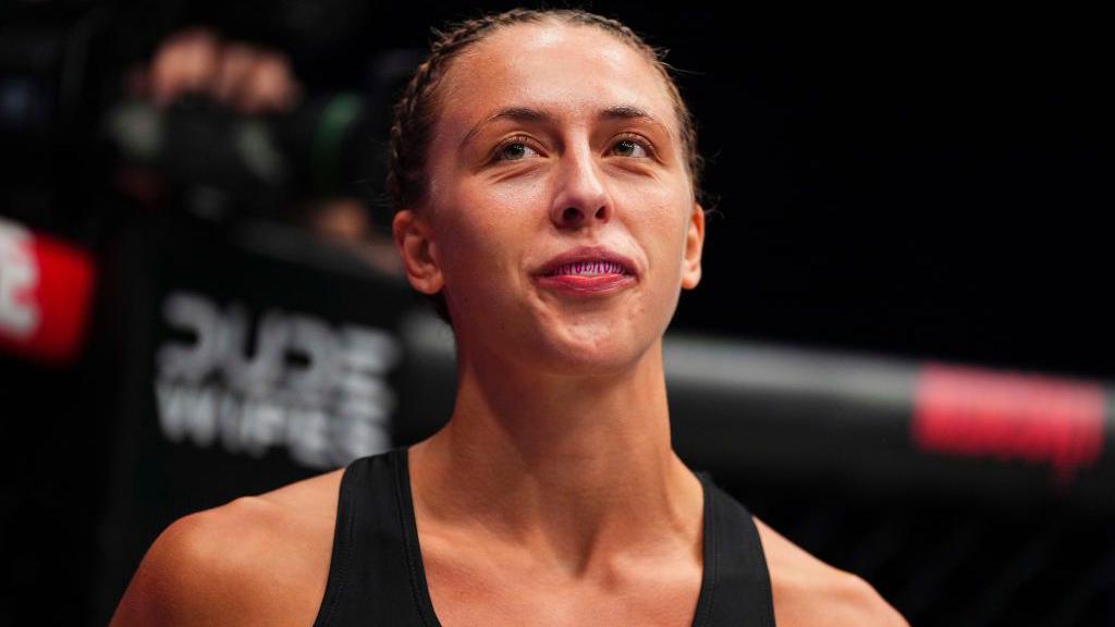 Dakota Ditcheva is wearing a gumshield and smiling
