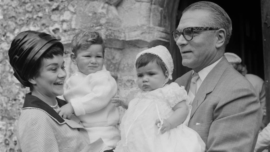 Joan Plowright and Sir Laurence Olivier at the christening of their daughter Tamsin in 1963