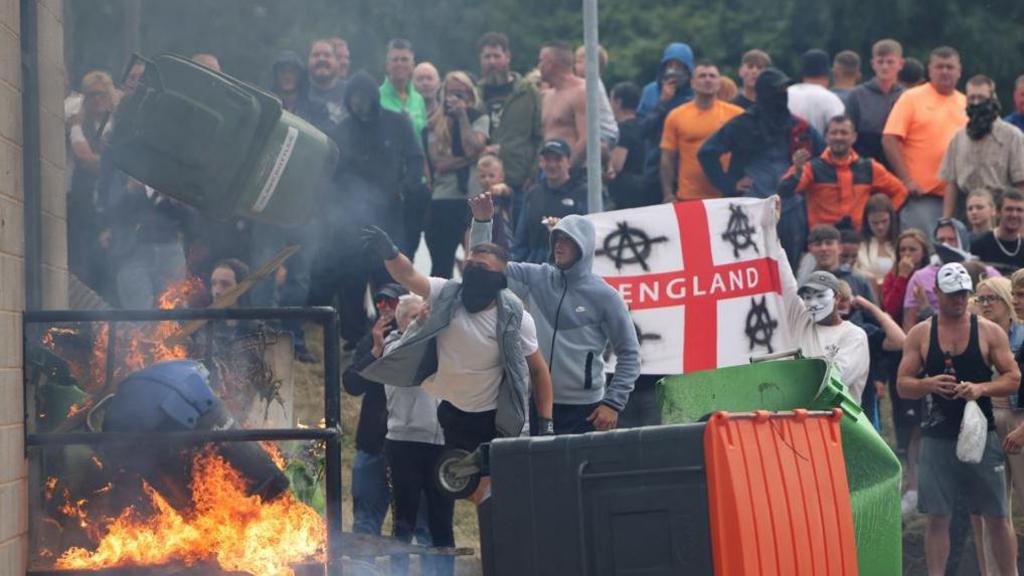 People at a riot at a hotel in Rotherham