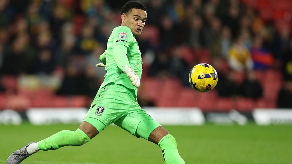 Pierce Charles kicks the ball downfield