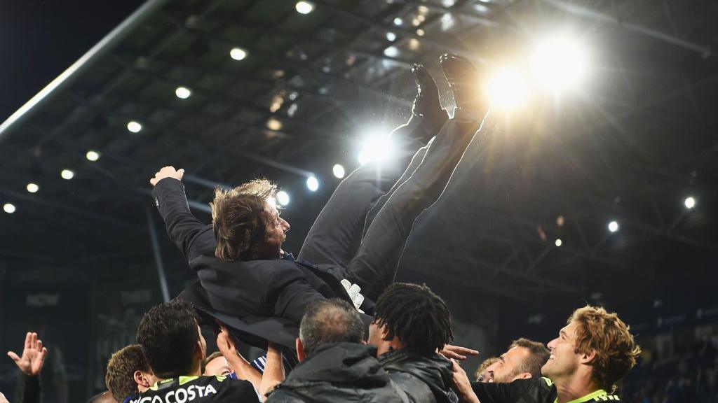 Chelsea boss Antonio Conte is pictured being given 'the bumps' by his players after his Chelsea side beat the Baggies at The Hawthorns to clinch the Premier League title in 2017. The celebrations continued long into the night.