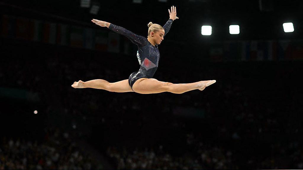 Ruby Evans competing in the balance beam event during the Paris Olympics in 2024.
