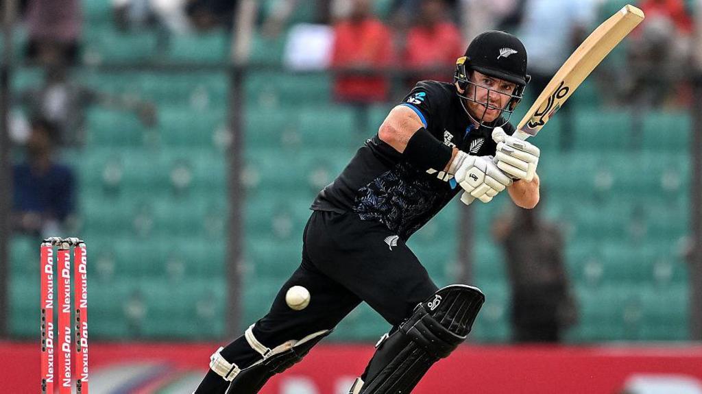 Nick Kelly clips the ball off his pads during an international match for New Zealand.
