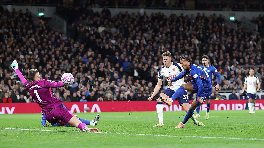 Joao Pedro of Chelsea scores the opening goal against Tottenham