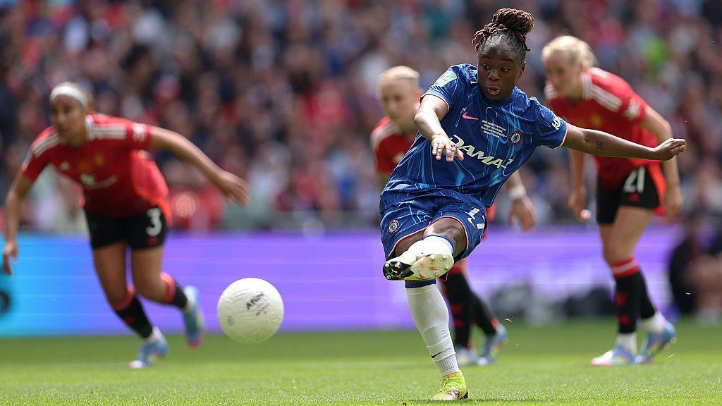 Sandy Baltimore scoring Chelsea's first goal from the penalty spot.