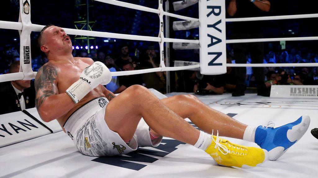 Oleksandr Usyk reacts after being knocked down by Daniel Dubois in 2023