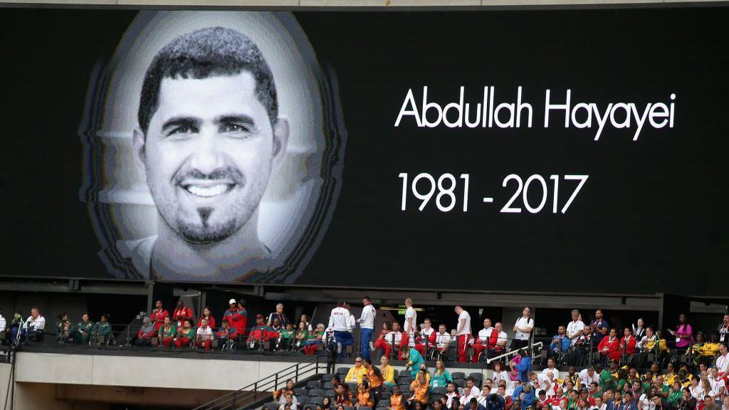 A board showing the face of Abdullah Hayayei 